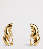 Alaïa Torsion drop earrings brass, imported from the UK