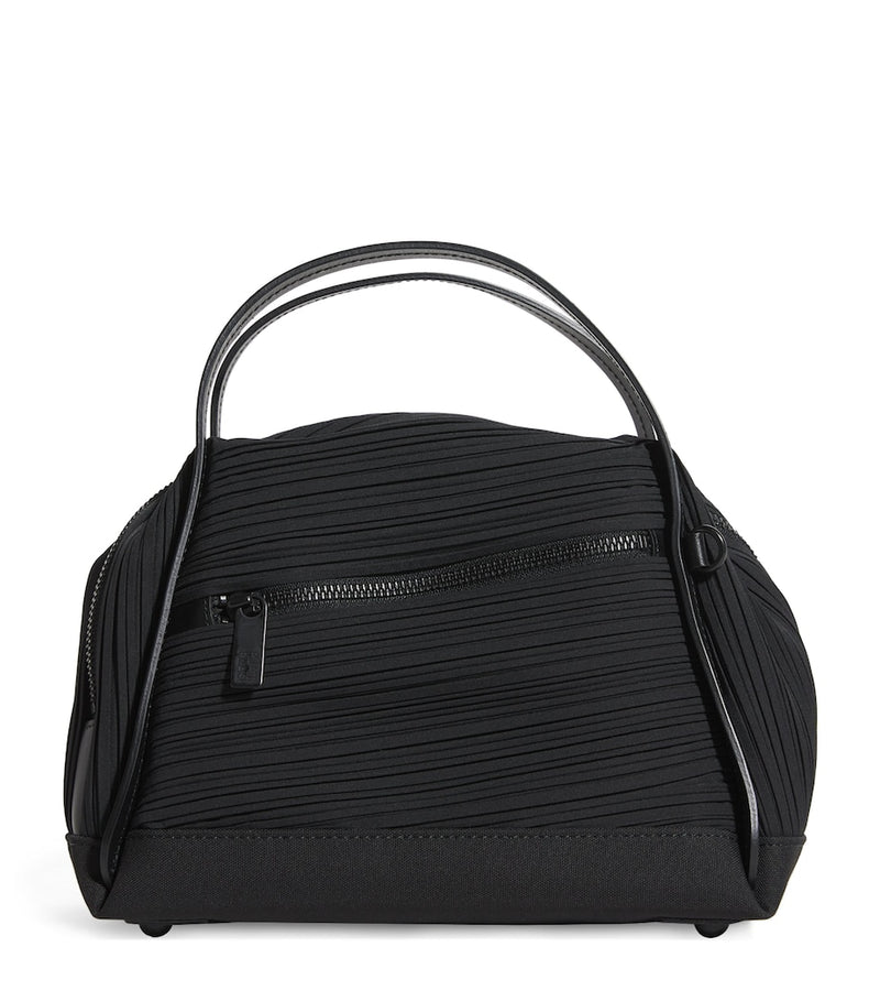 Pleats Please Issey Miyake mini bias pleats duffle bag, imported from the UK
