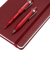 Ensemble de papeterie comprenant un stylo roller, un porte-mine et un carnet en cuir