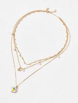 Next Oliver Bonas Blue Emory Lemon Pendant Triple Row Faux Pearl Necklace- Buy online at McGrocer