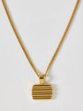 Oliver Bonas gold tone waterproof ridged disc pendant necklace, UK version