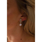SVNX pearl drop earrings in gold stainless steel, imported from the UK