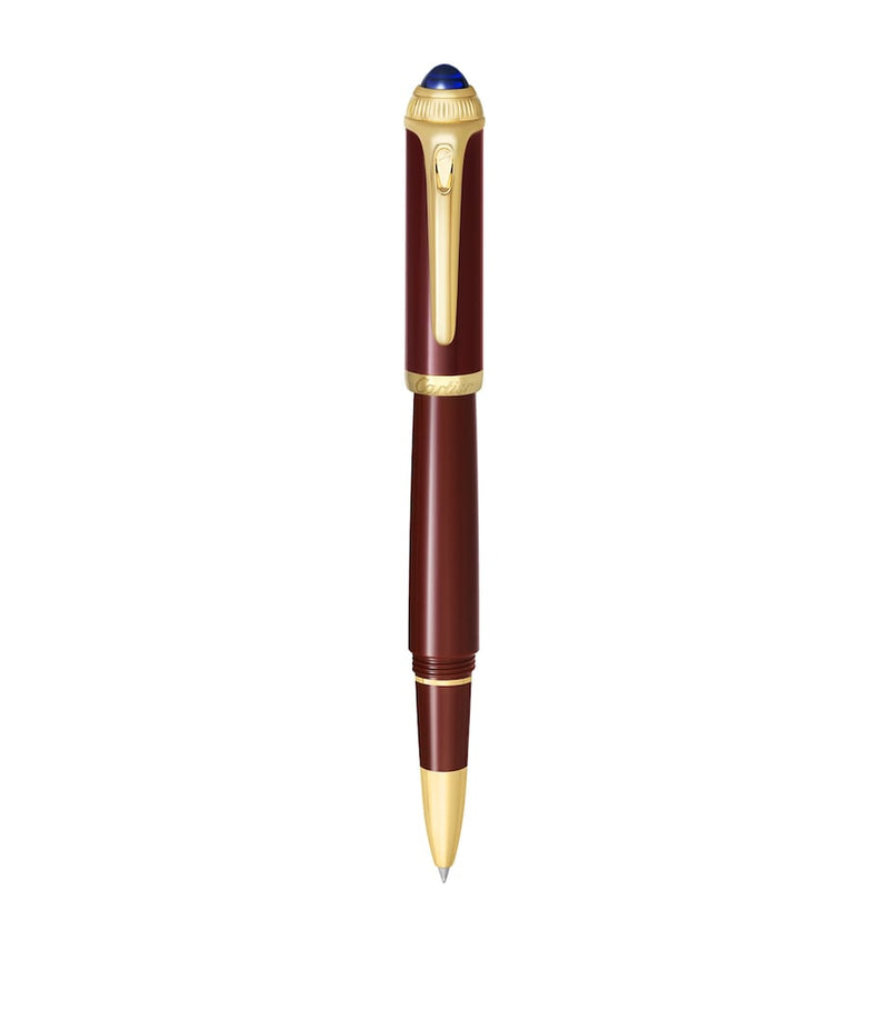 Cartier composite rollerball pen with gold-tone details and blue resin cabochon, 15cm length - British product