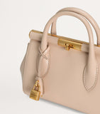 Dolce&Gabbana leather top-handle bag with gold-tone hardware, imported from the UK
