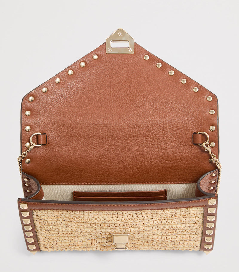 Valentino Garavani mini straw Rockstud cross-body bag - British product