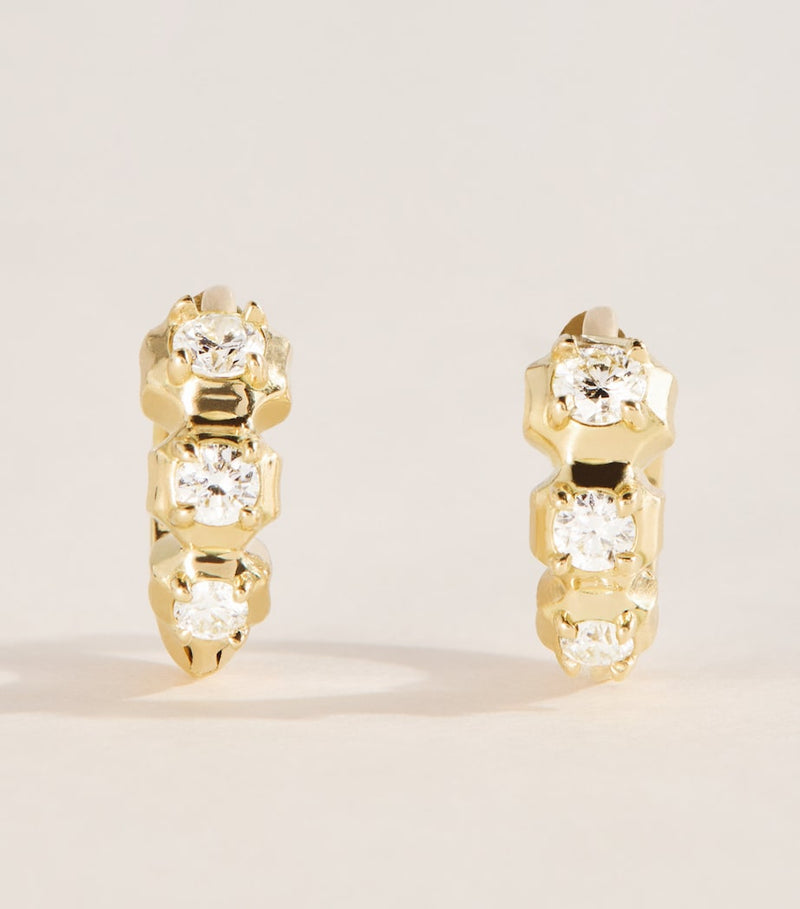 Jade Trau mini yellow gold diamond huggie earrings, imported from the UK