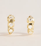 Jade Trau mini yellow gold diamond huggie earrings, imported from the UK