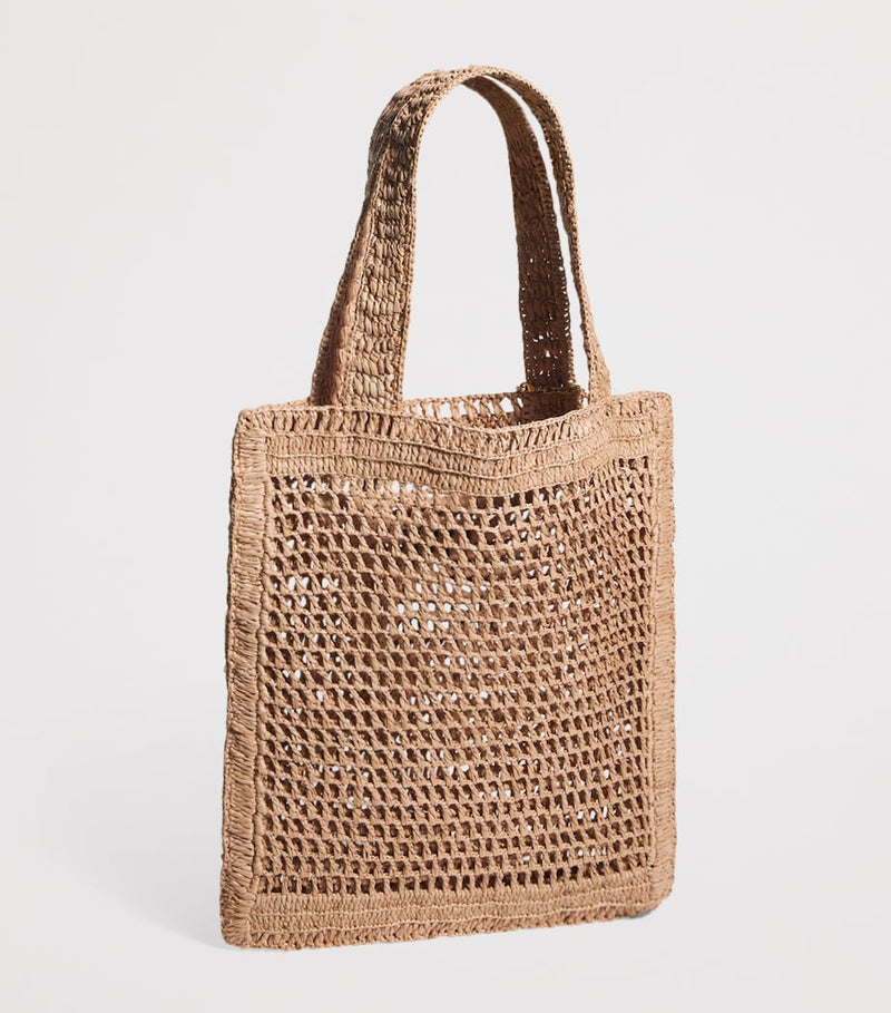 Chloé handwoven banana tote bag with gold charm, imported from the UK