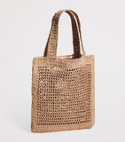 Chloé handwoven banana tote bag with gold charm, imported from the UK