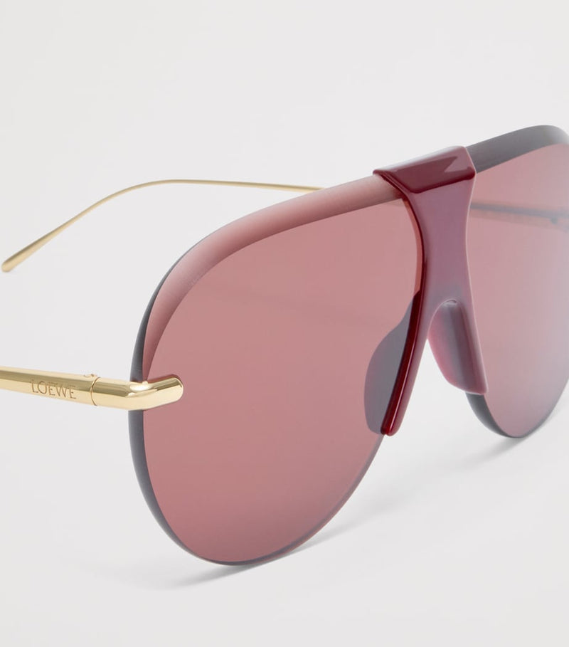 LOEWE aviator sunglasses with red tint and steel frame, imported from the UK