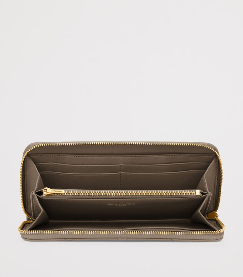 Saint Laurent Matelassé zip-up wallet with YSL monogram (British brand)