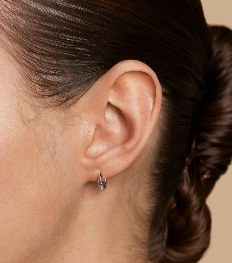 Astrid & Miyu pavé knot huggies earrings (British brand)
