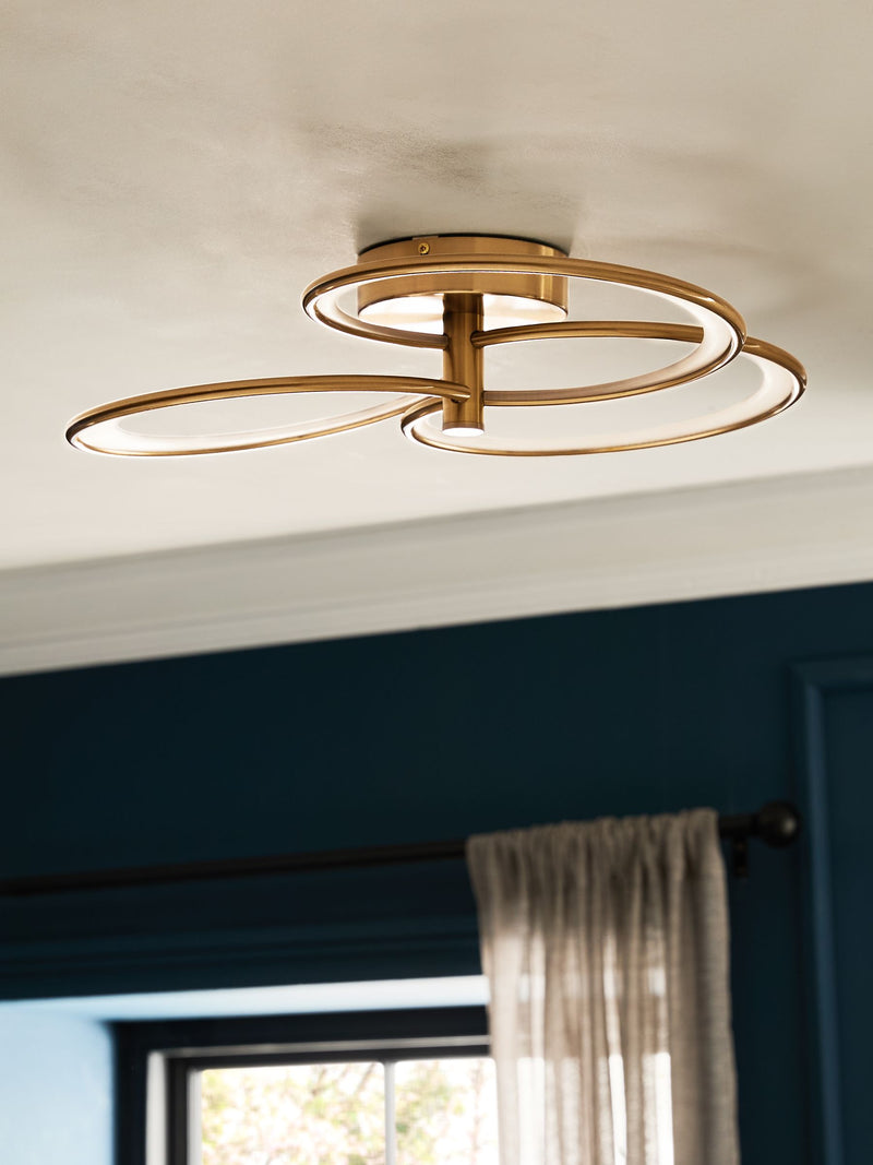 Raya flush ceiling light with brass finish and integrated LED (British brand)