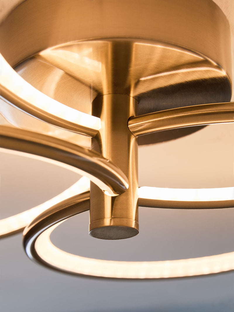 Raya flush ceiling light with brass finish and integrated LED (British brand)