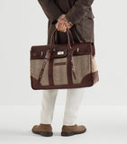 Brunello Cucinelli leather-trim chevron holdall, imported from the UK