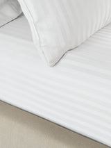 Next Catherine Lansfield White Satin Stripe Fitted Sheet- Buy online at McGrocer