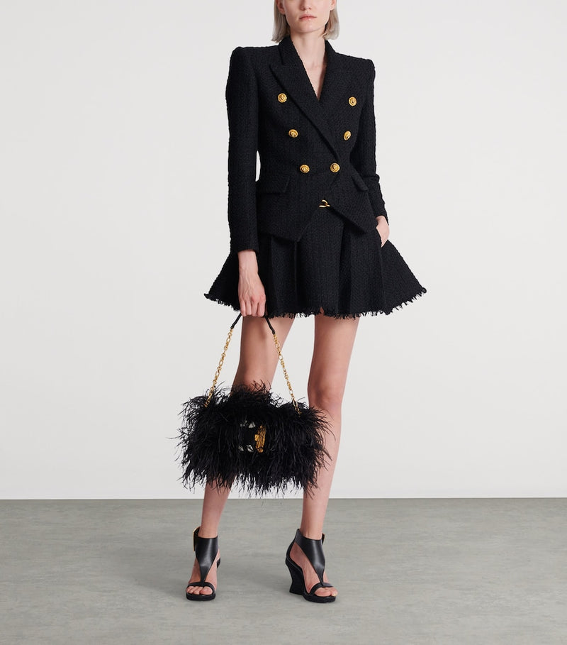 Balmain Anthem clutch bag with long fibres and gold buckle, imported from the UK
