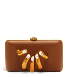 Schiaparelli Hand In Hand clutch bag with rhinestone fingernails, imported from the UK