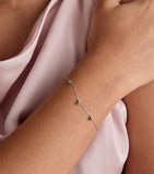 Astrid & Miyu white gold and emerald pear charm bracelet, UK version
