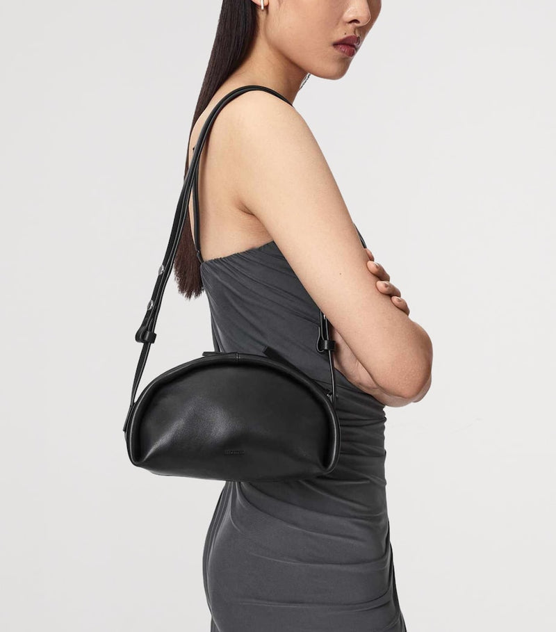 AllSaints Rosalie Arc cross-body bag in calfskin leather, imported from the UK