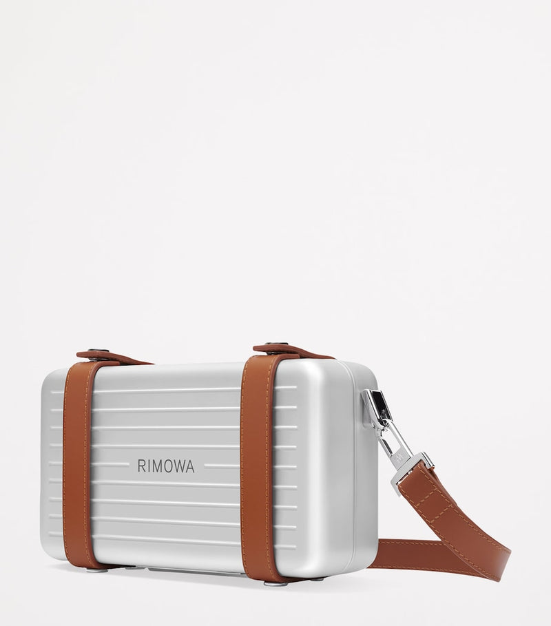 RIMOWA aluminium cross-body bag with leather strap (British brand)