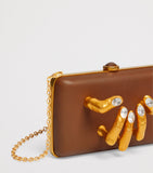 Schiaparelli Hand In Hand clutch bag with rhinestone fingernails, imported from the UK
