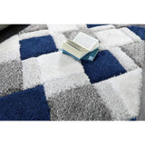 Origins 3D geometric navy shaggy rug 120x170cm, imported from the UK