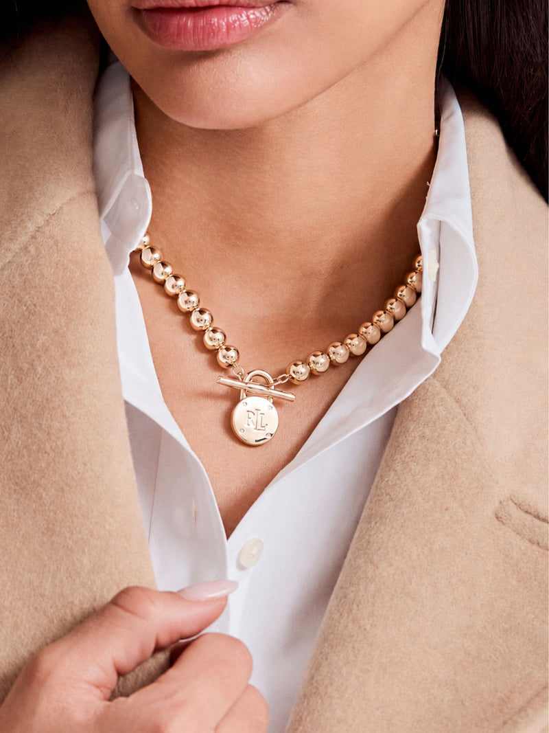 Lauren Ralph Lauren gold bead necklace with engraved pendant, UK version