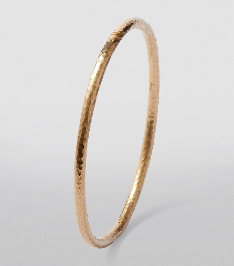 Annoushka yellow gold bangle with hand-hammered finish, imported from the UK