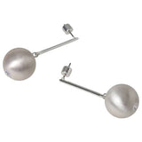 Liars & Lovers silver tone ball drop earrings, UK version