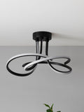 Black sculptural LED flush ceiling light - British product