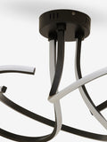 Black sculptural LED flush ceiling light - British product