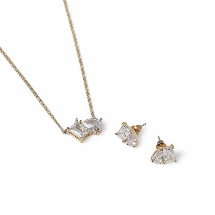Liars & Lovers gold tone necklace and earring set, imported from the UK