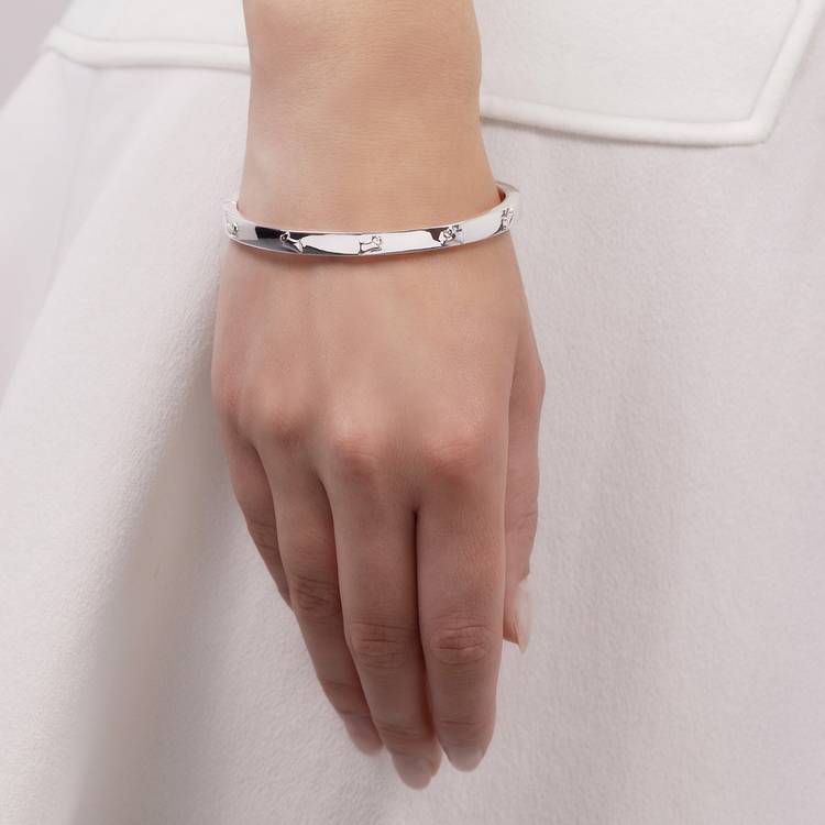 Radley silver plated jumping dog bangle, UK version