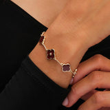 Lipsy gold clover bracelet with burgundy charm, UK version
