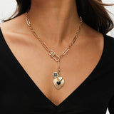 Lipsy gold tone jet heart charm necklace, imported from the UK
