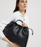 Brunello Cucinelli large leather Mellow bucket bag, imported from the UK