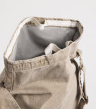 Our Legacy denim sling shoulder bag with mineral pigment, imported from the UK