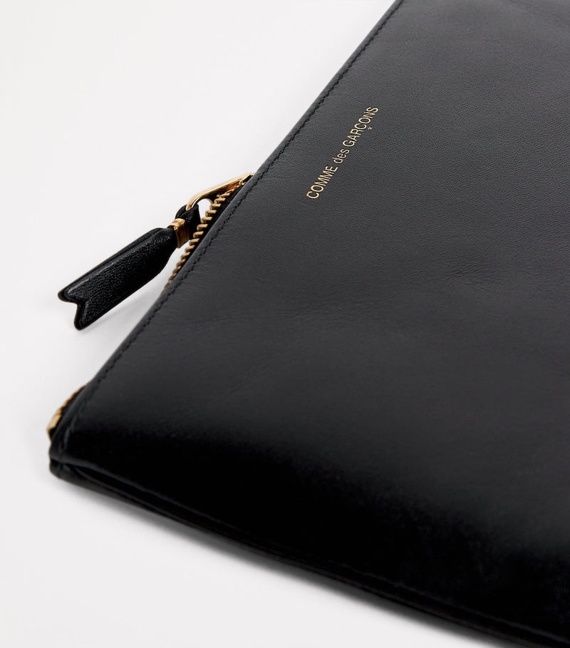 Comme des Garçons large leather zipped pouch - British product
