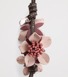 Anya Hindmarch leather Sakura charm, imported from the UK