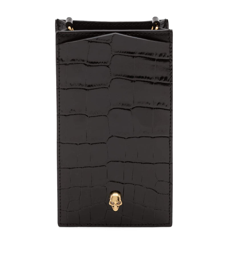 McQueen skull-embellished croc-embossed leather phone case, imported from the UK