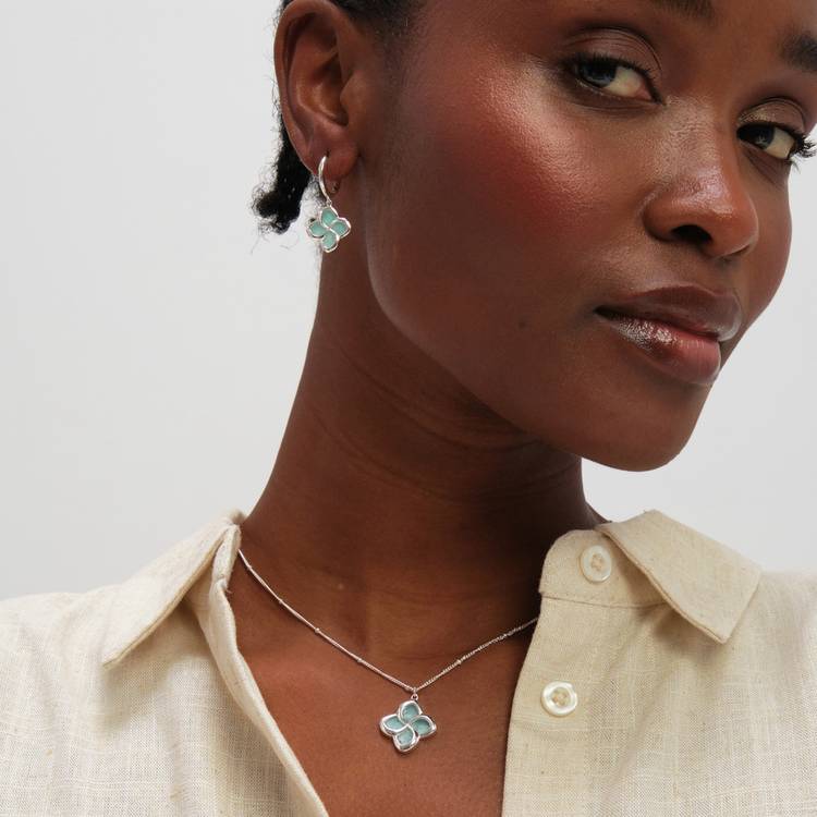 Inicio huggie hoop earrings with turquoise clover, UK version