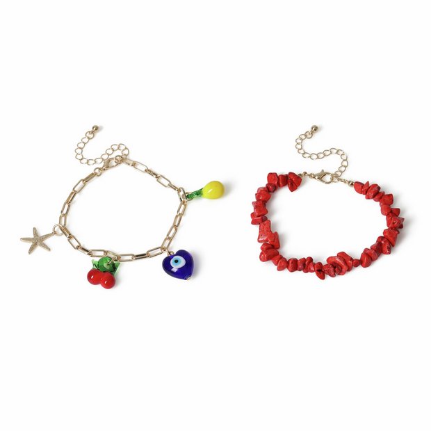 Freedom charm bracelet gold tone with red bead detail 19cm, imported from the UK