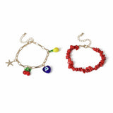 Freedom charm bracelet gold tone with red bead detail 19cm, imported from the UK