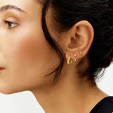 Revere gold plated silver stud earrings with blue stone, UK version