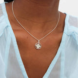 Revere Inicio silver plated mother of pearl spinner clover pendant (British brand)