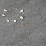 Freedom gold tone blue bead and shell anklet set (British brand)