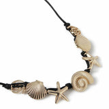 Revere gold-tone shell and starfish necklace on black cord (British brand)