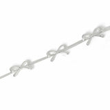 Freedom silver-tone three bows thin bracelet 19cm, imported from the UK