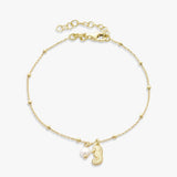 Revere gold plated seahorse charm bracelet with faux pearl (British brand)